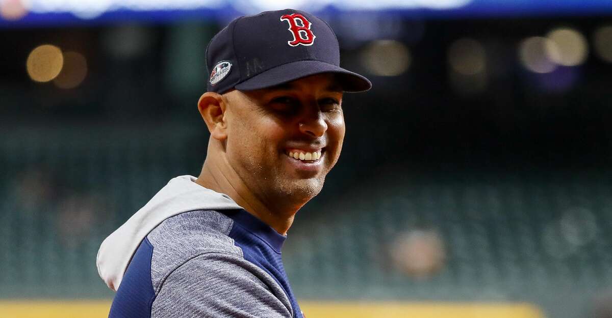 Boston Red Sox manager Alex Cora laughs as people sing "Happy Birthday" to him before Game 5 of the American League Championship Series at Minute Maid Park on Thursday, Oct. 18, 2018, in Houston.