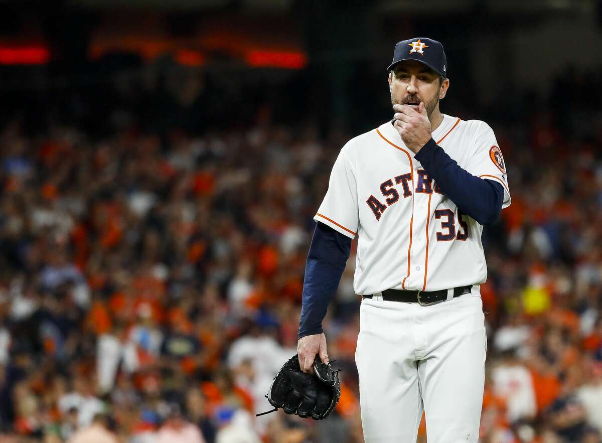 Houston Astros starting pitcher Justin Verlander (35) walks to the dugout at the end of the top of the fifth inning after allowing the Red Sox to take a 4-0 lead on a three-run home run by Boston Red Sox Rafael Devers (11) during Game 5 of the American League Championship Series at Minute Maid Park on Thursday, Oct. 18, 2018, in Houston.