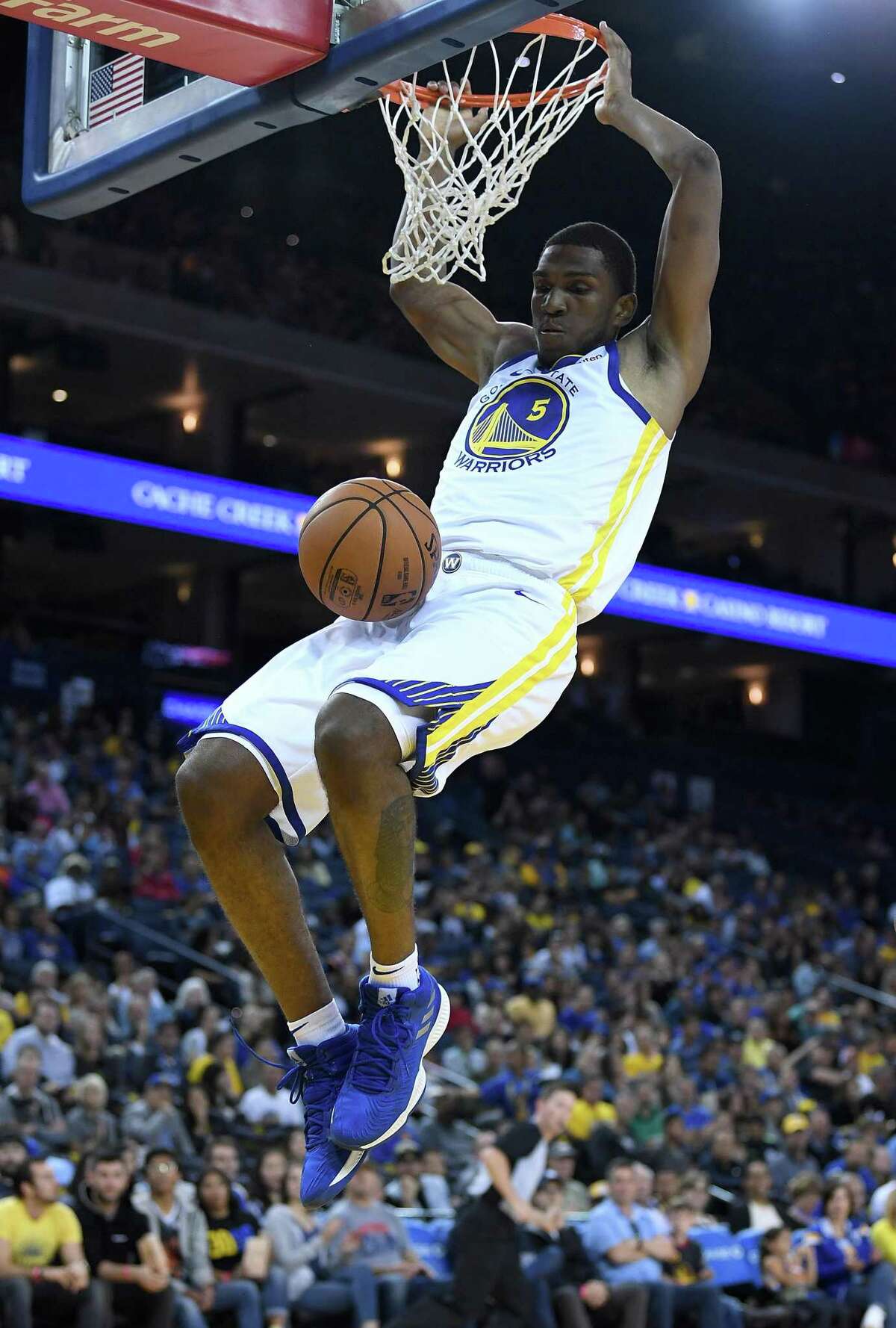 Golden State Warriors center-forward Kevon Looney worked out at a jiujitsu studio as part of his offseason regimen. The training has helped put him into a key backup role on the team. OAKLAND, CA - SEPTEMBER 29: Kevon Looney #5 of the Golden State Warriors goes up for a slam dunk against the Minnesota Timberwolves during an NBA basketball game at ORACLE Arena on September 29, 2018 in Oakland, California. NOTE TO USER: User expressly acknowledges and agrees that, by downloading and or using this photograph, User is consenting to the terms and conditions of the Getty Images License Agreement. (Photo by Thearon W. Henderson/Getty Images)