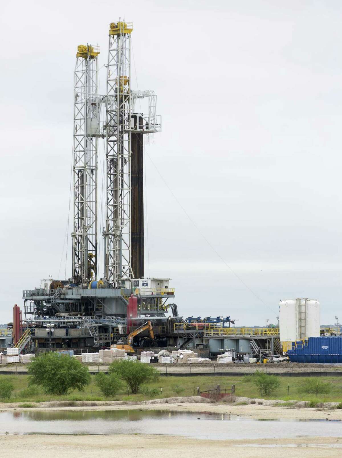 Drilling rigs in the Eagle Ford Shale in October. U.S. oil production has hit record levels and oil prices have plummeted, with global markets concerned about overproduction.