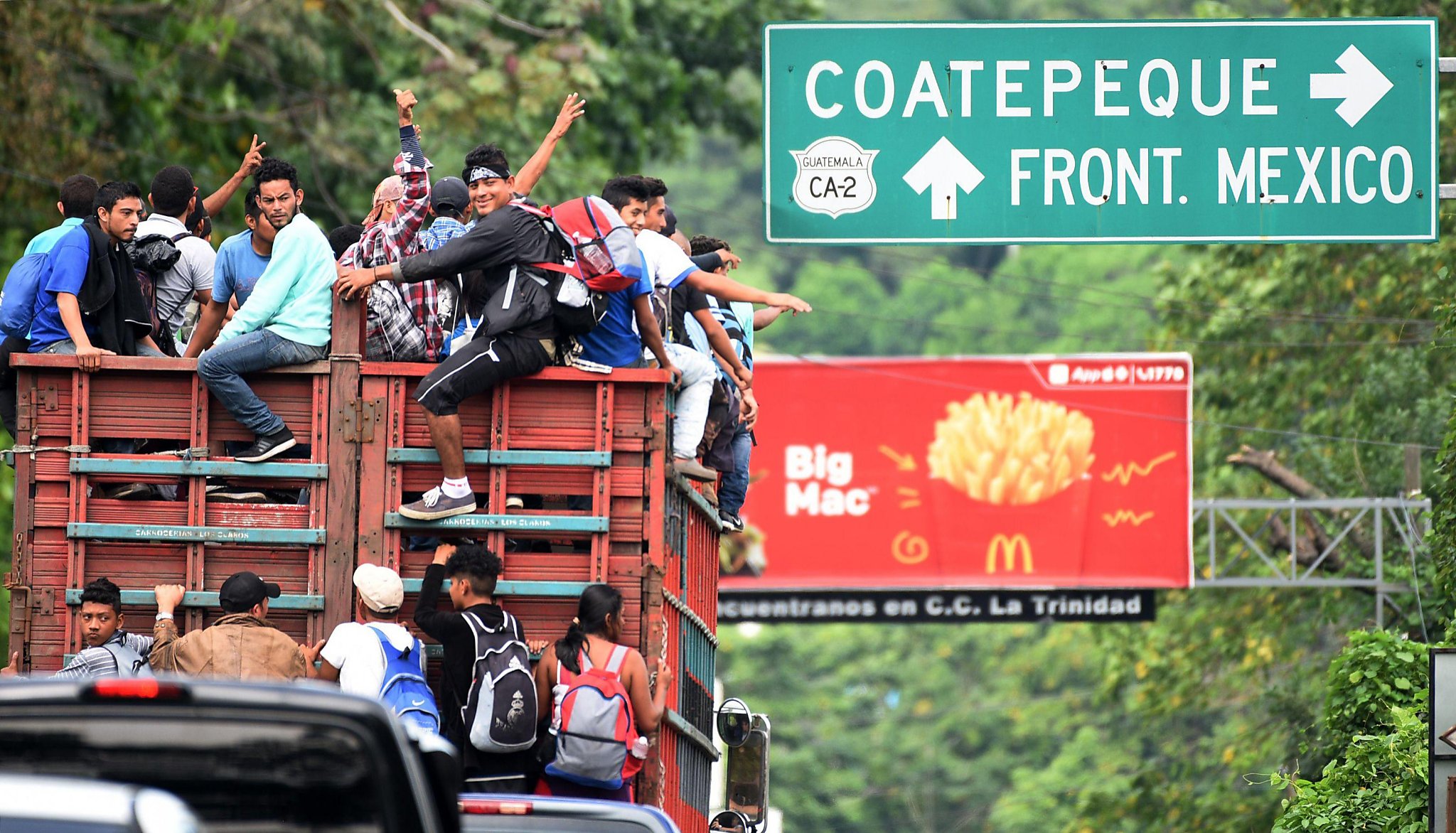 Caravan Migrants Rush Border Fence At Mexican Border