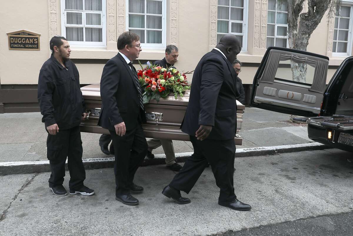 Owner Steve Welch (middle) including his staff tend to a funeral at Duggan�s funeral home on Thursday, Oct. 18, 2018, in San Francisco, Calif. Family-owned funeral home Duggan�s celebrates its 100th anniversary.