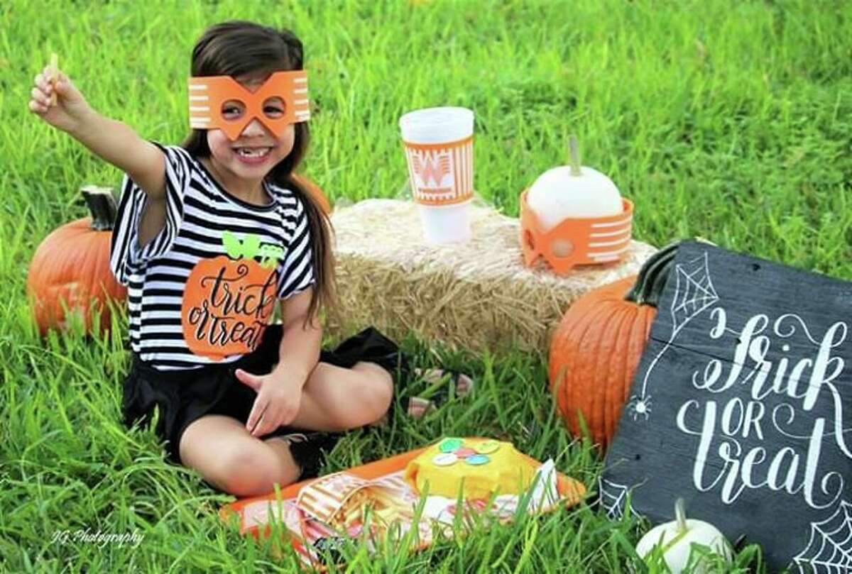 Gonzales-based JG Photography said Whataburger's orange theme inspired their latest fall photos with 4-year-old model Ashlynn. Photos shared with mySA.com show the pumpkin-colored burger wrapper and cup falls perfectly into the backdrop as the little girl snacks on her favorite food.