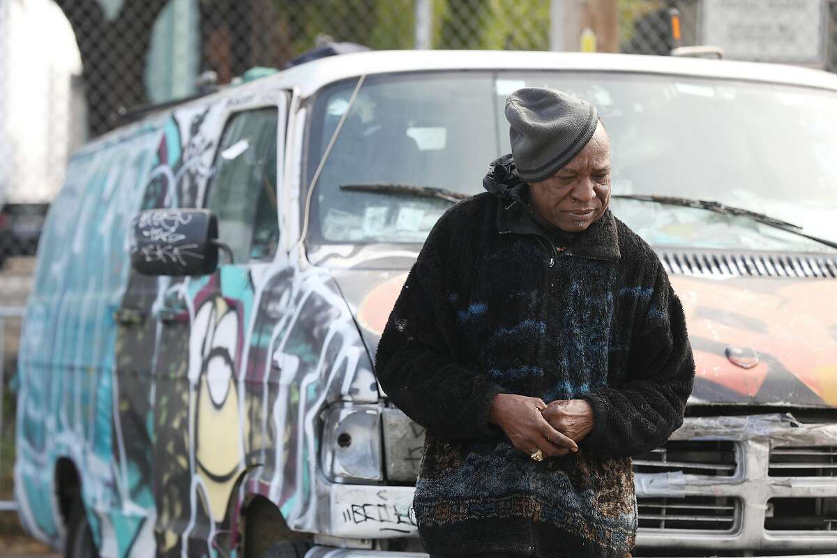Oscar Lewis Williamson leans against his van along San Bruno Avenue on Thursday, October 18, 2018 in San Francisco, Calif. Available parking spaces are one of the issues that Williamson feels would help the homeless.