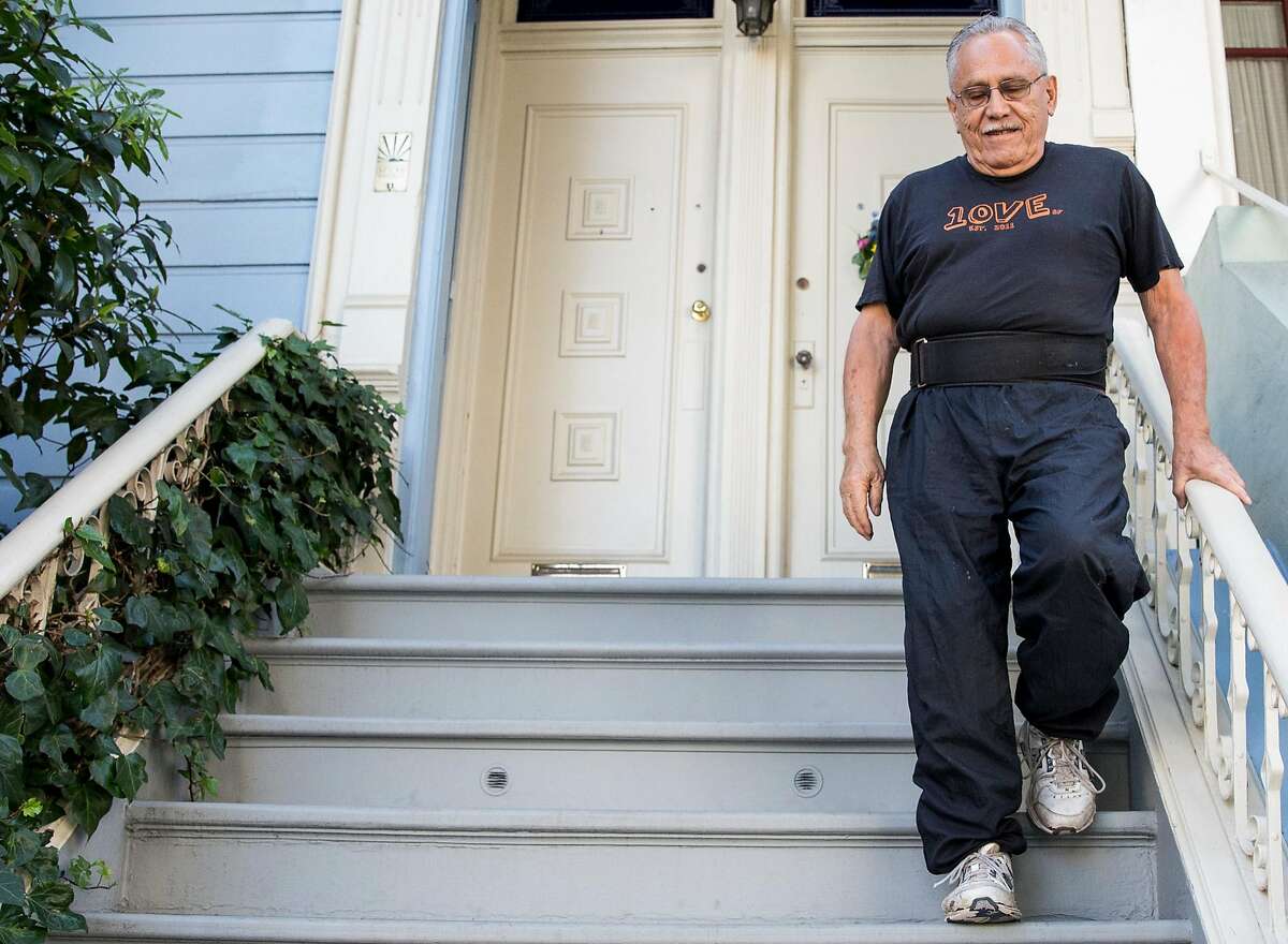 Airbnb host Rudolfo Cancino walks down his front steps while heading to work on the garden with his wife, Karen, at their home in San Francisco, Calif. Thursday, Oct. 18, 2018.
