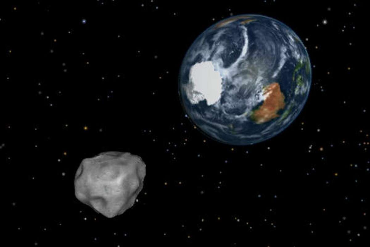 FILE — This NASA illustration depicts an asteroid during a close approach.