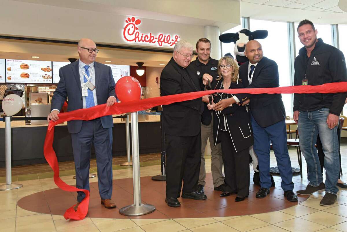 A ribbon is cut as Albany International Airport hosts a Grand Opening Celebration for the area's first Chick-fil-A on Friday, Oct. 19, 2018 in Colonie, N.Y. (Lori Van Buren/Times Union)