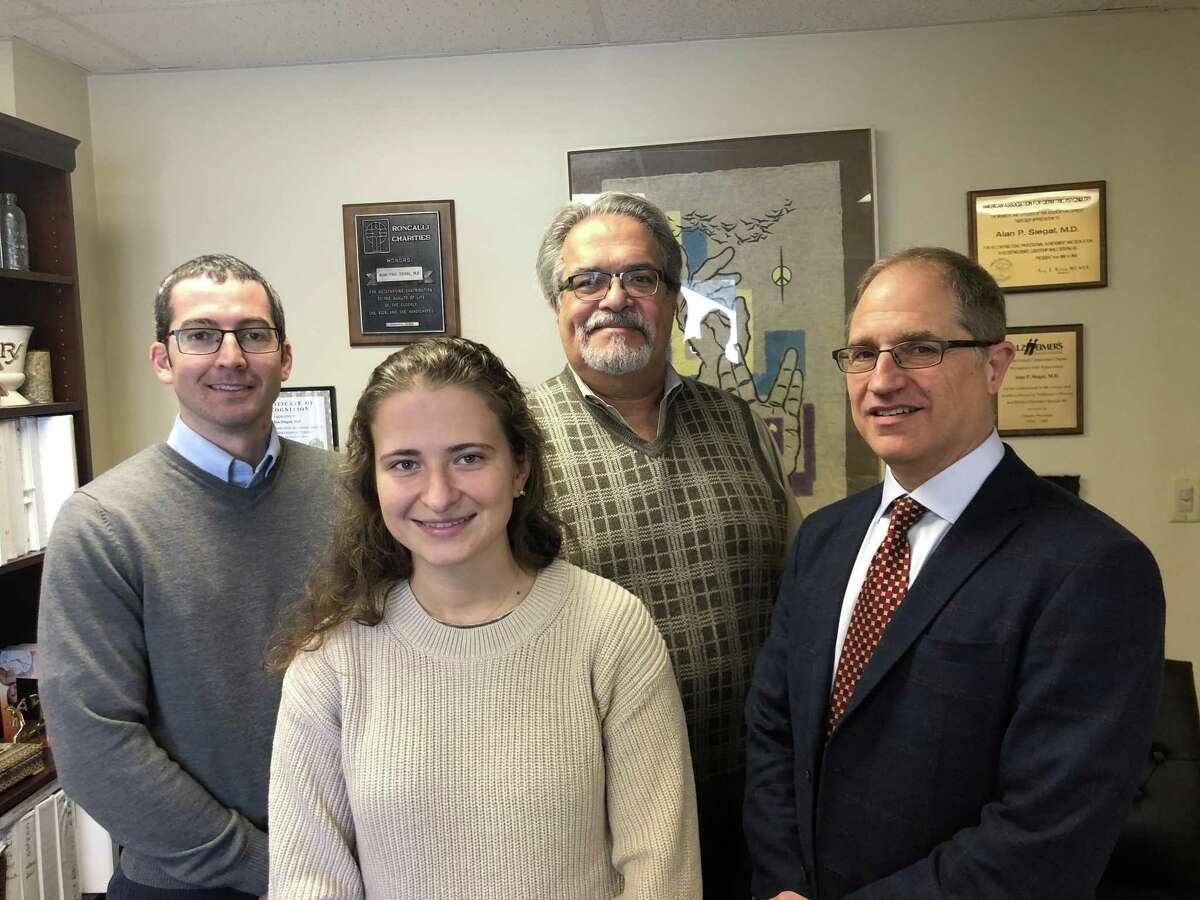 From left, Dr. Adam Mecca of the Yale Alzheimer's Disease Research Unit, Sylwia Lipior, clinical research coordinator at the unit, Dr. Alan Siegal, psychiatrist at Geriatric and Adult Psychiatry in Hamden, and Dr. Robert Berman, chief medical officer of Biohaven Pharmaceuticals in New Haven.