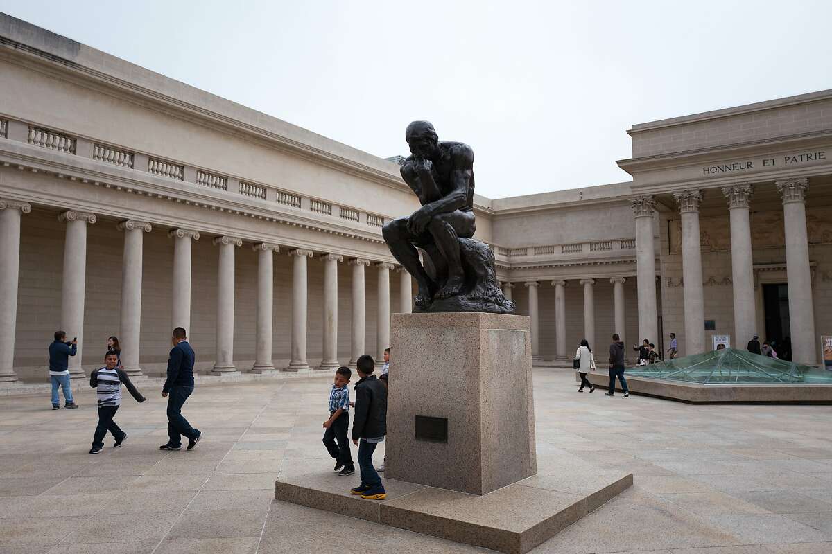 In the courtyard of the Legion of Honor art museum in the Lands End neighborhood of San Francisco, children play near The Thinker, a bronze statue by French artist Auguste Rodin. Beginning Oct. 19, residents of all nine counties of the Bay Area will be able to attend both the de Young and Legion of Honor Museums free of charge.