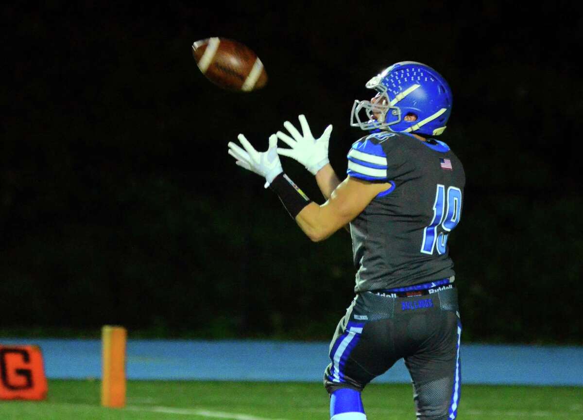 Bunnell's James Savko completes a pass in the end zone to score a touchdown against Masuk during high school football action in Stratford, Conn., on Friday Oct. 19, 2018.