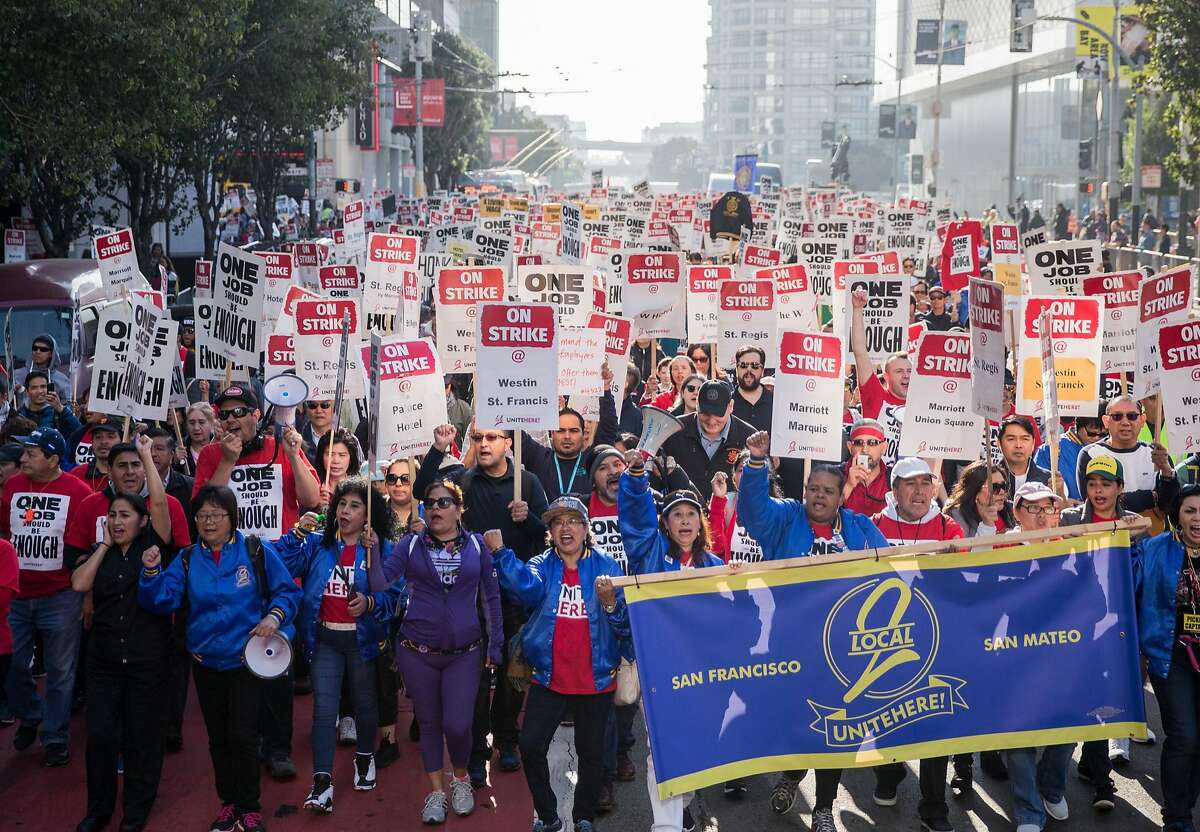 More than one thousand hotel and hospitality workers on strike from seven different Marriott-affiliated hotels march through the streets of San Francisco, Calif. Saturday, Oct. 20, 2018.