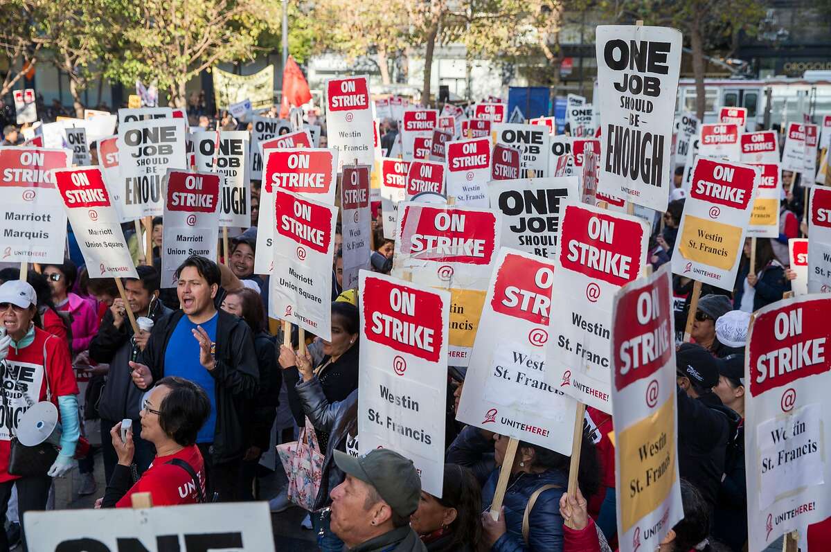 Hotel and hospitality workers on strike from seven different Marriott-affiliated hotels gather at Yerba Buena Lane and Market Street Saturday, Oct. 20, 2018 in San Francisco, Calif. before taking to the streets in a massive march.