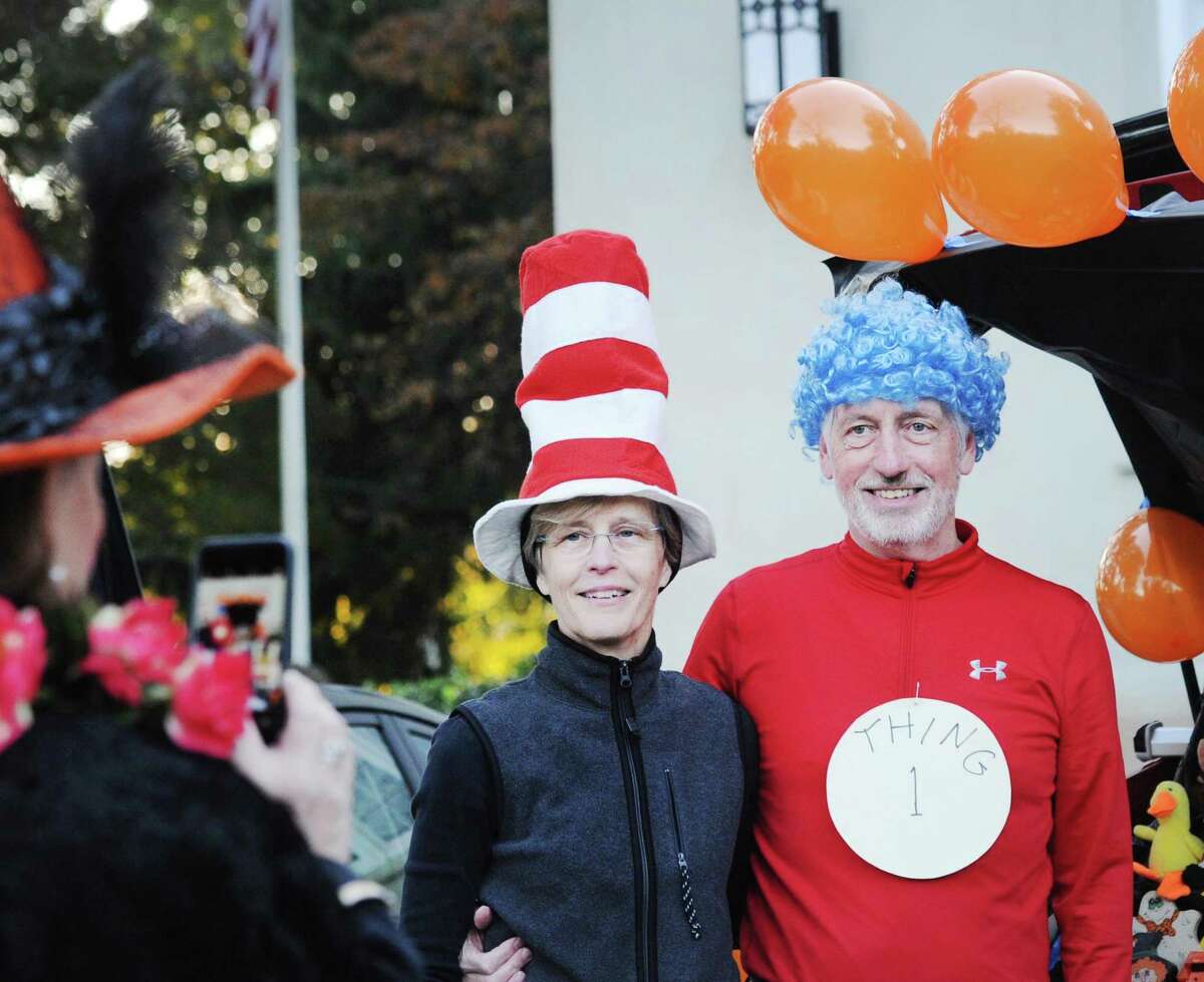 Husband and wife, Rick and Marilyn Derr of Greenwich came as Dr. Seuss characters "The Cat in the Hat" and "Thing 1", for the "Trunk or Treat" Halloween event at the First Congregational Church in Old Greenwich, Conn., Saturday night, Oct. 20, 2018. The event featured the Halloween-themed decorated trunks of cars of the participants in the parking lot of the church.