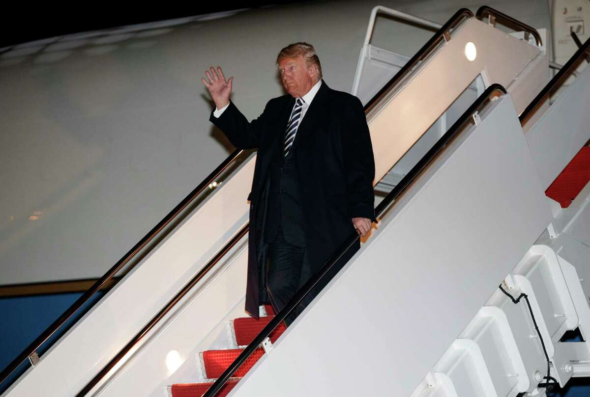 President Donald Trump dismbarks from Air Force One, Saturday, Oct. 20, 2018, in Andrews Air Force Base, Md., en route to Washington returning from a campaign rally in Elko, Nev.