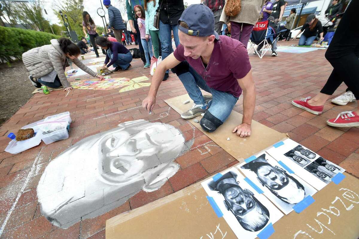 Zachary Chernak of Naugatuck draws Frankenstein during the New Haven Chalk Art Festival on the Broadway Island in New Haven on October 20, 2018. Chernak is an art teacher at Cooperative Arts & Humanities High School in New Haven.