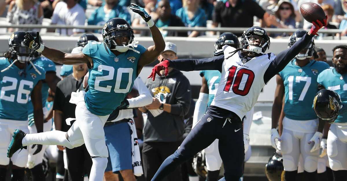Houston Texans wide receiver DeAndre Hopkins (10) beats Jacksonville Jaguars cornerback Jalen Ramsey (20) with q one-handed catch for a first down during the first quarter of an NFL football game at TIAA Bank Field on Sunday, Oct. 21, 2018, in Jacksonville.