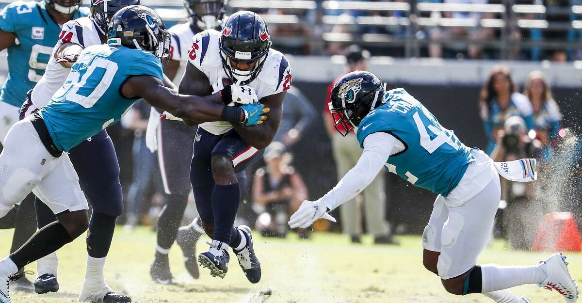 PHOTOS: Texans vs. Jaguars Houston Texans running back Lamar Miller (26) runs between Jacksonville Jaguars linebacker Telvin Smith (50) and strong safety Barry Church (42) during the fourth quarter of an NFL football game at TIAA Bank Field on Sunday, Oct. 21, 2018, in Jacksonville. Browse through the photos to see action from the Texans' win over the Jaguars.