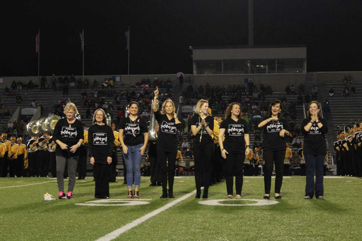 With a big smile and few laughs, the original director of the Conroe High School Golden Girls performed the Tiger Boogie among 99 alumnae in a special halftime performance that marked 50 years of celebrations.