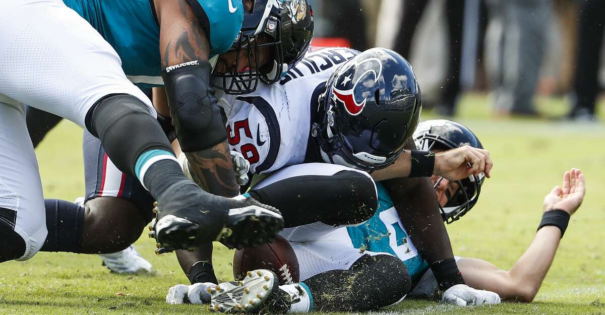 PHOTOS: Texans vs. Jaguars Houston Texans linebacker Whitney Mercilus (59) fights for a fumble after stripping the ball away from Jacksonville Jaguars quarterback Cody Kessler (6) during the fourth quarter of an NFL football game at TIAA Bank Field on Sunday, Oct. 21, 2018, in Jacksonville. Browse through the photos to see action from the Texans' game against the Jaguars.