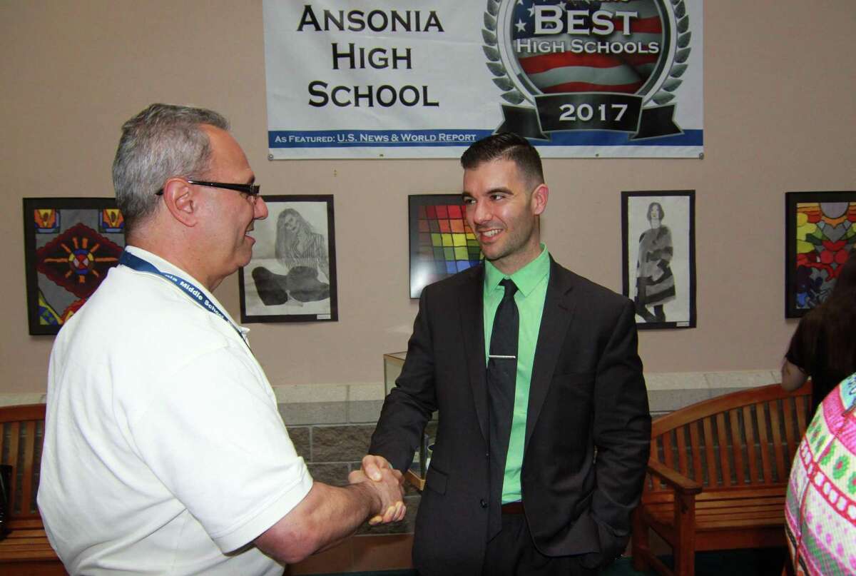 New Ansonia High School principal, Paul Giansanti, right, greets Ansonia Board of Education member John Izzo during a meet-and-greet in May. Giansanti has announced a partnership with Griffin Hospital to offer a four-year Patient Care Technician course to high school freshmen.