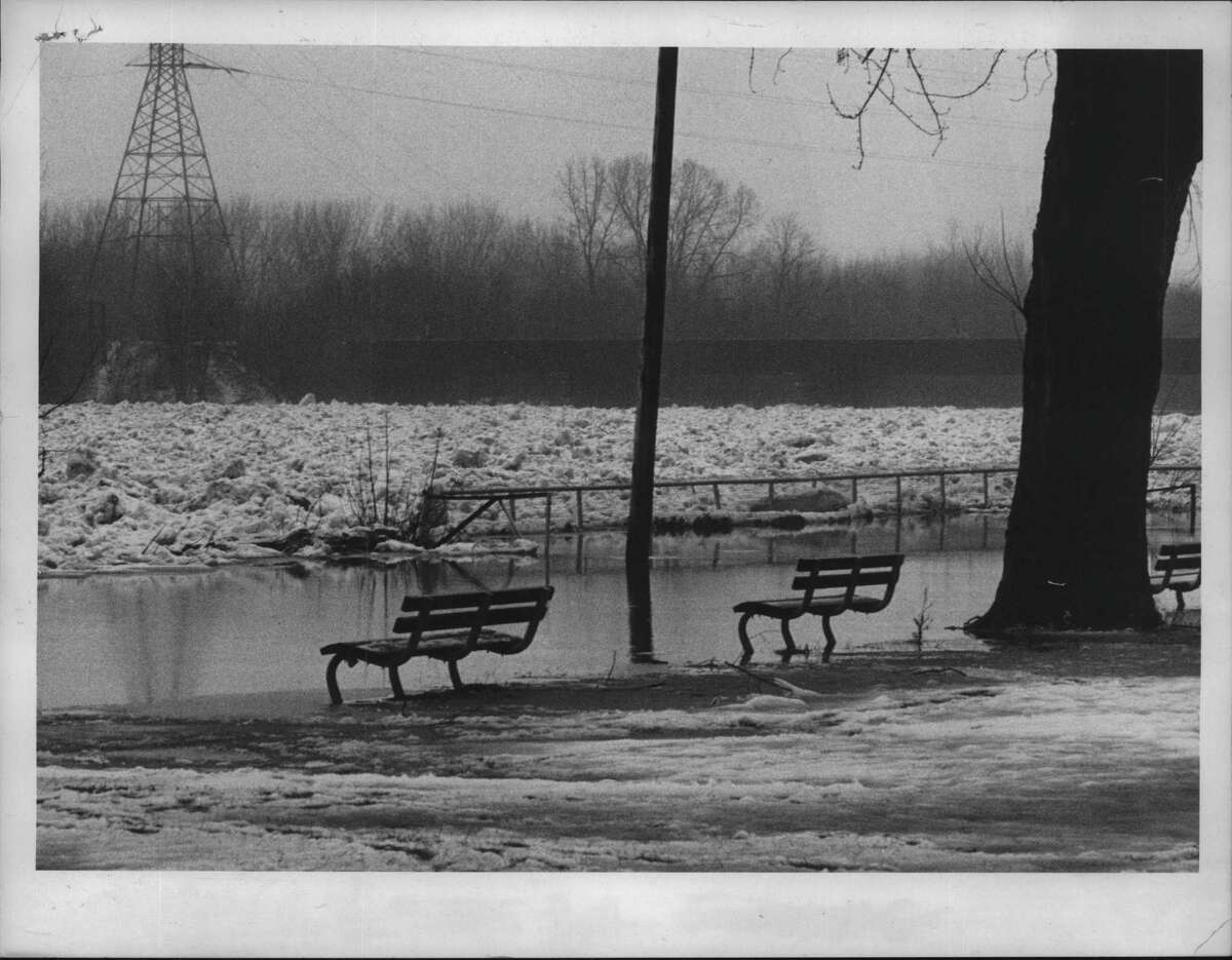 Feb. 2, 1976:Â Empty benches in snow-covered park, Stockade area of Schenectady, New York. February 19, 1976, two weeks after a flash freeze and brief blizzard. (Bud Hewig/Times Union Archive)