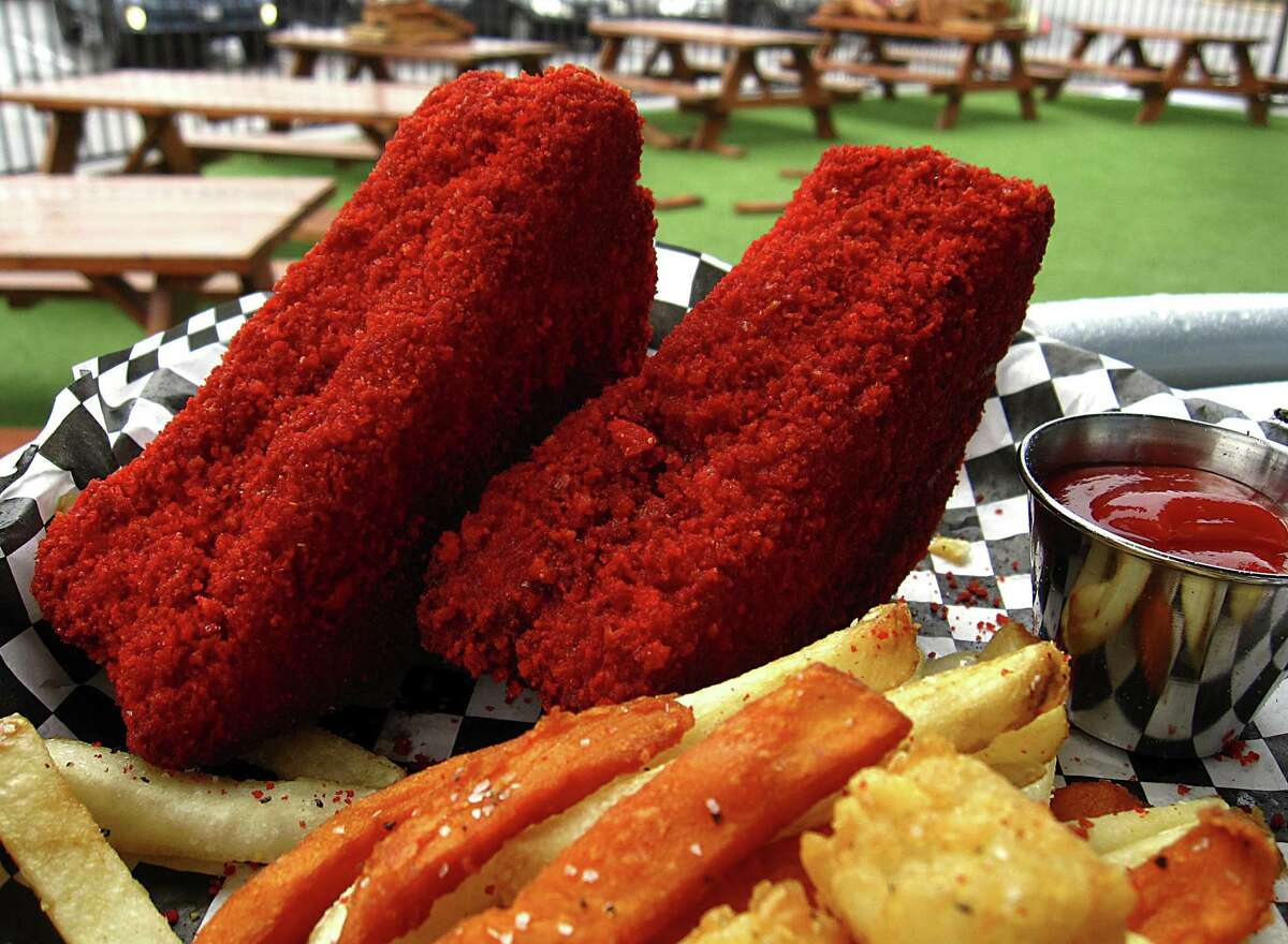 Click ahead to see the Hot Cheetos-flavored food you can find in San Antonio. Crusted Flaming Hot Cheeto grilled cheese sandwich with Trash Fries (fries, sweet potato fries, tater tots) from SandBox.