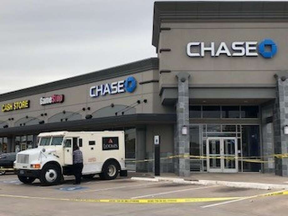 Image result for Robber pepper sprays armored car driver outside Chase Bank