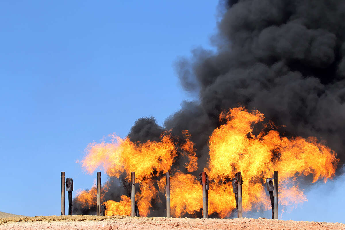 A picture taken on October 17, 2017 shows excess flammable gasses burning from gas flares at the Havana oil field, west of the multi-ethnic northern Iraqi city of Kirkuk. Iraqi forces took control of the two largest oil fields in the disputed northern province of Kirkuk demolishing Kurdish hopes of creating a viable independent state. / AFP PHOTO / AHMAD AL-RUBAYE (Photo credit should read AHMAD AL-RUBAYE/AFP/Getty Images)