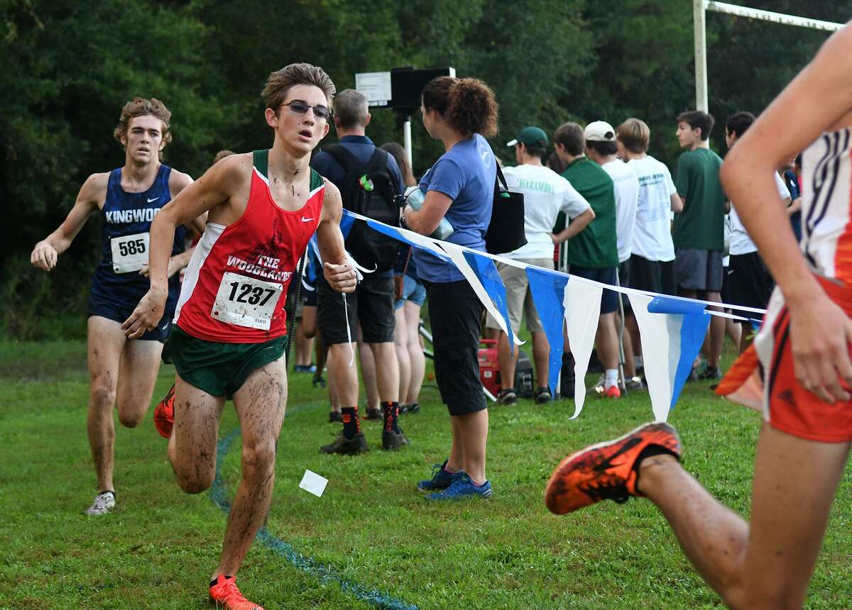 In this file photo, The Woodlands’ Spencer Cardinal (1237) and Kingwood's Carter Storm (585) compete during the Varsity Boys race at the Andy Wells Invitational at Kingwood High School on Sept. 15, 2018.