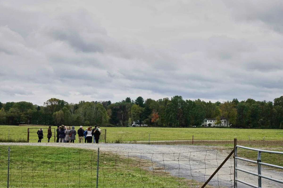 Visitors take a tour following a press conference at the Pitney Meadows Community Farm on Monday, Oct. 22, 2018, in Saratoga Springs, N.Y. The press conference was held to announce the Farmland for a New Generation New York program. (Paul Buckowski/Times Union)