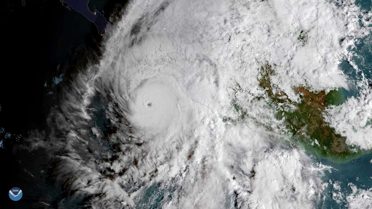 This GOES East satellite image provided by NOAA shows Hurricane Willa in the eastern Pacific, on a path toward Mexico's Pacific coast on Monday, Oct. 22, 2018. (NOAA via AP)