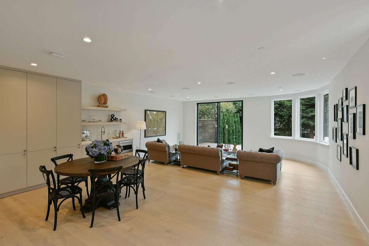 A family room on the lower level opens to the landscaped backyard.