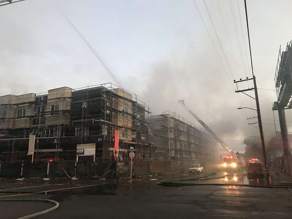 A huge fire broke out at a construction site in Oakland early Tuesday destroying six buildings that were part of a new condo project, authorities said