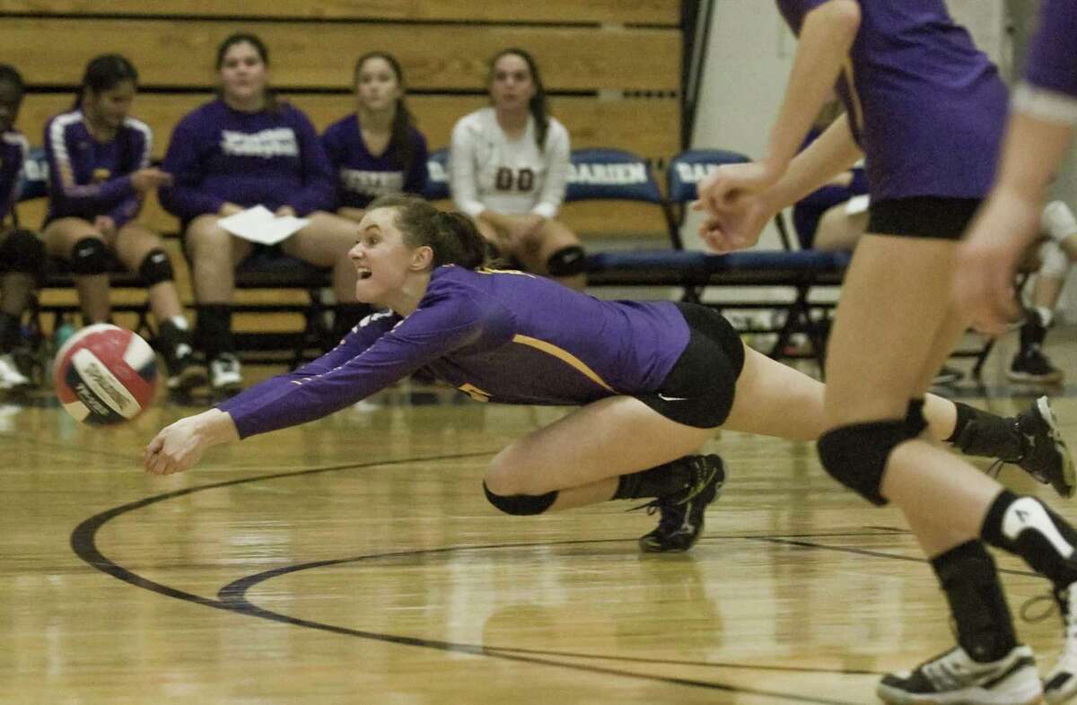 Westhill’s Betsy Sachs tries to dig out the ball in a 3-0 sweep of Darien Monday in Darien.