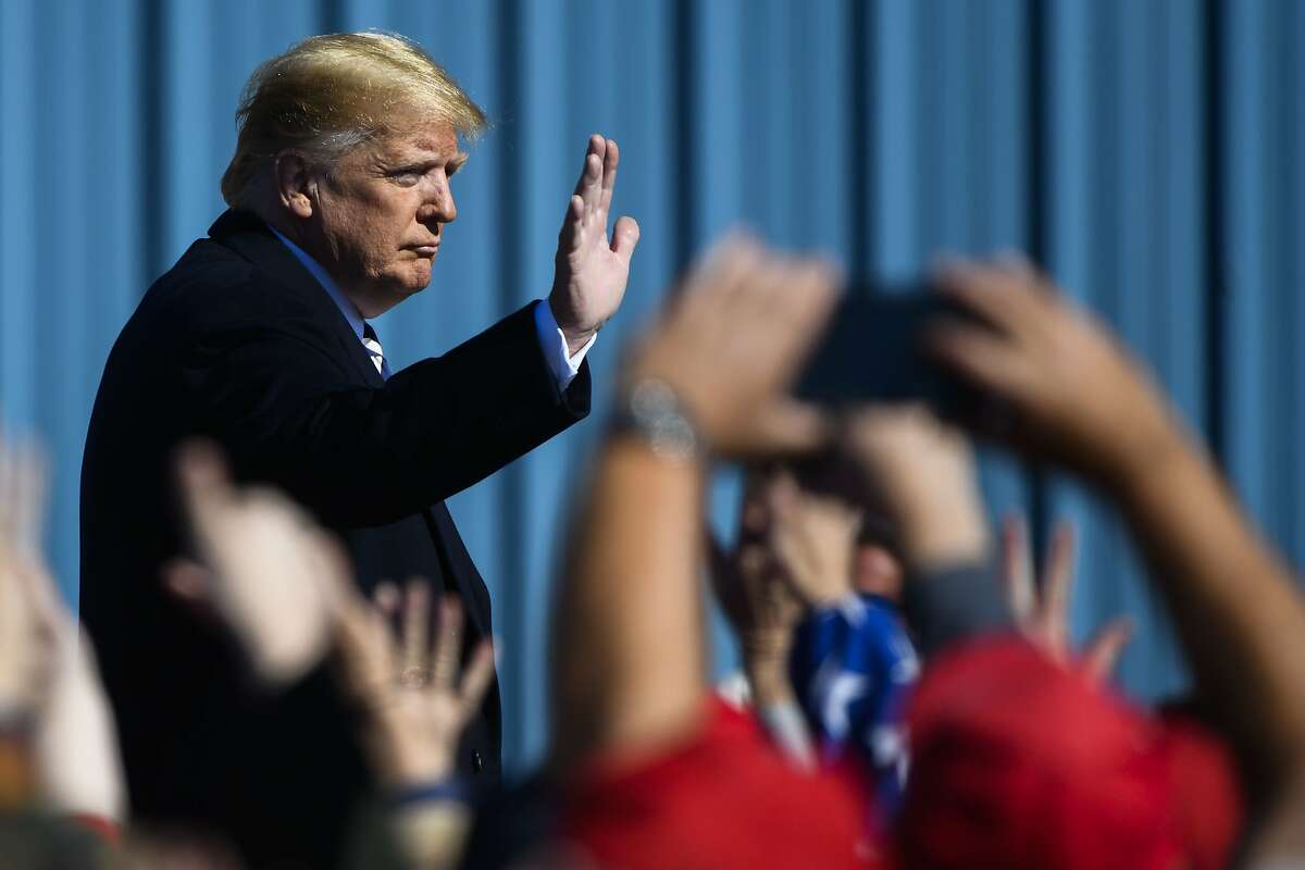 President Donald Trump waves to a crowd before leaving a campaign rally on Saturday, Oct. 20, 2018 in Elko, Nev. (AP Photo/Alex Goodlett)