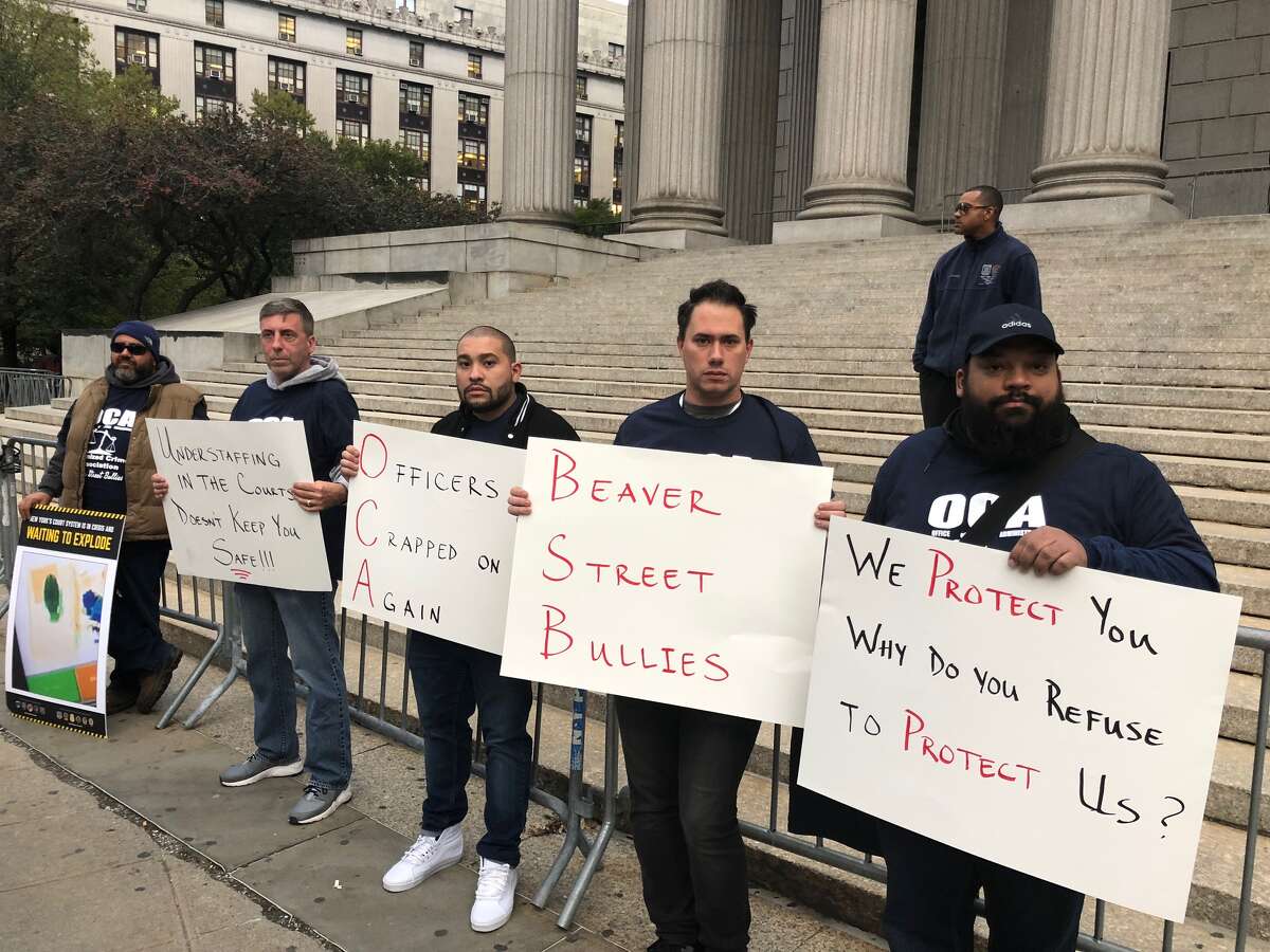 Court officers protest staffing levels outside an event for Chief Judge Janet DiFiore.