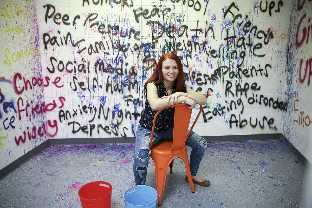 Smash Therapy owner Jennifer Morales in the children's room in Spring, Texas on Wednesday, Oct. 3, 2018 . The room gives children as young as six, a chance to throw paint balls at stressors in their lives.