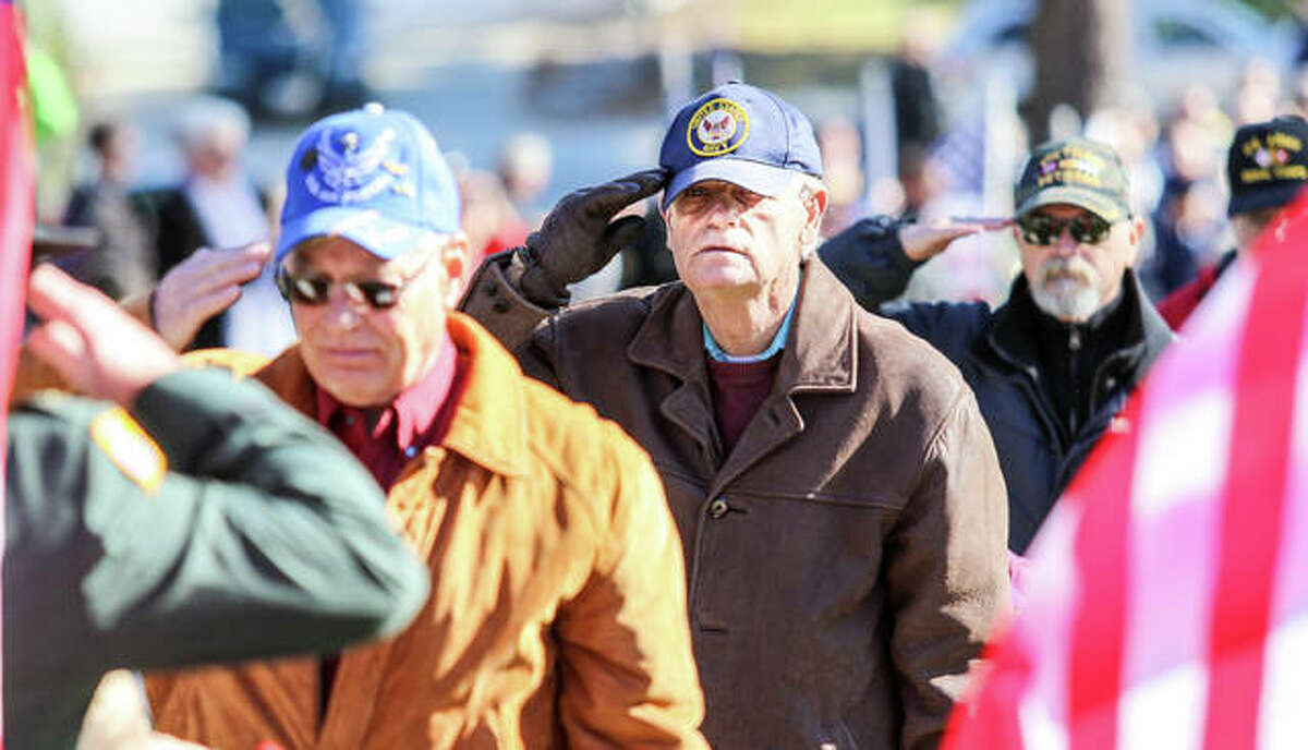 The 2017 file photos show participants assisting in placing 560 wreaths on graves at Alton National Cemetery during the annual “Wreaths Across America” ceremony. “Be Their Witness” is this year’s theme for the annual wreath-laying ceremony, scheduled for the same time across the country at 11 a.m. Saturday, Dec. 15.
