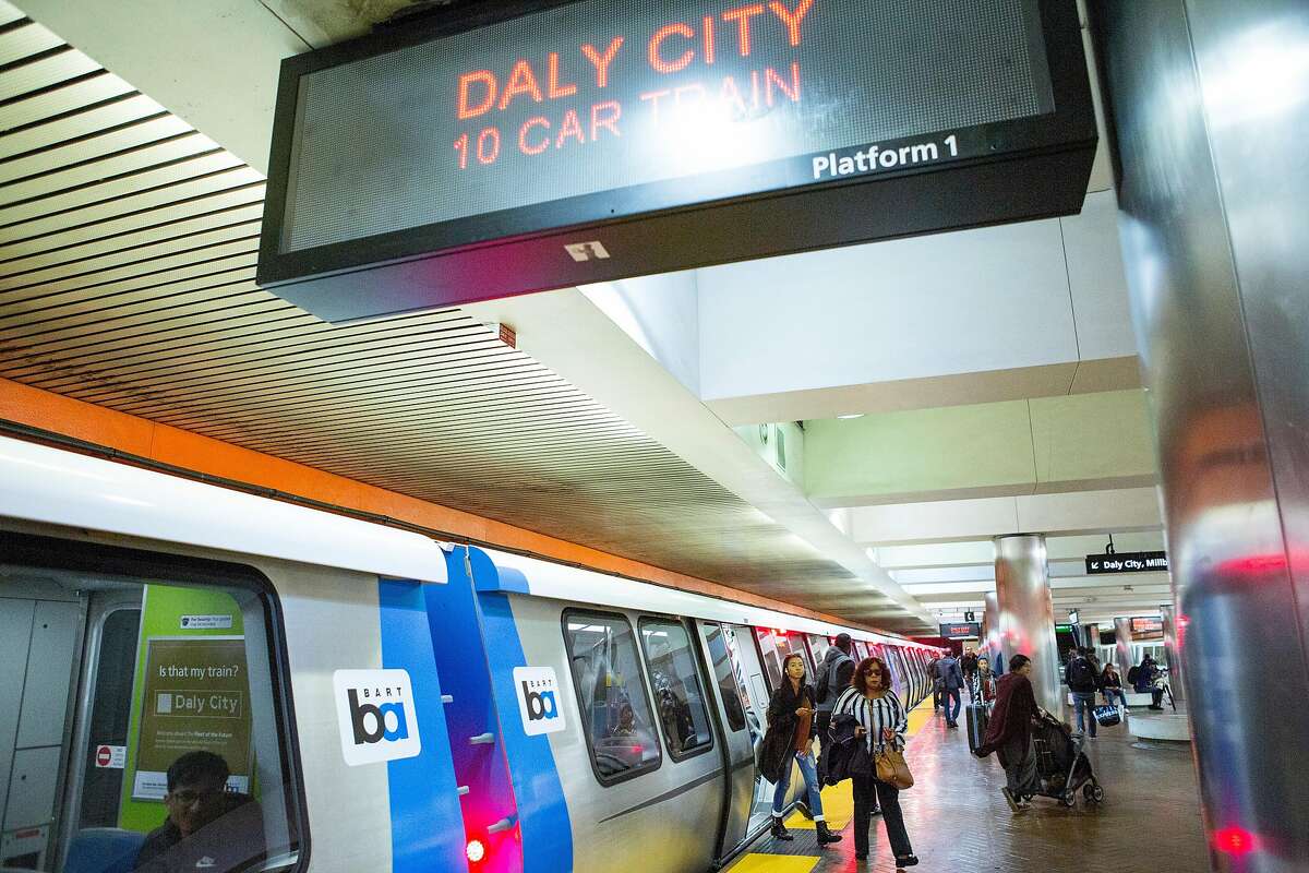 People get off the new BART train at the Powell Street Station that's heading toward Daly City on Wednesday, Oct. 24, 2018, in San Francisco, Calif. After many delays, BART has begun running its new trains on complete routes from the East Bay to stations in San Francisco and Daly City.