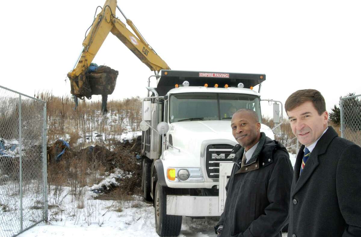 Hamden Administrative Assistant Scott Jackson, left, and Mayor Craig Henrici at the stump dump behind Hamden Middle School in 2009.