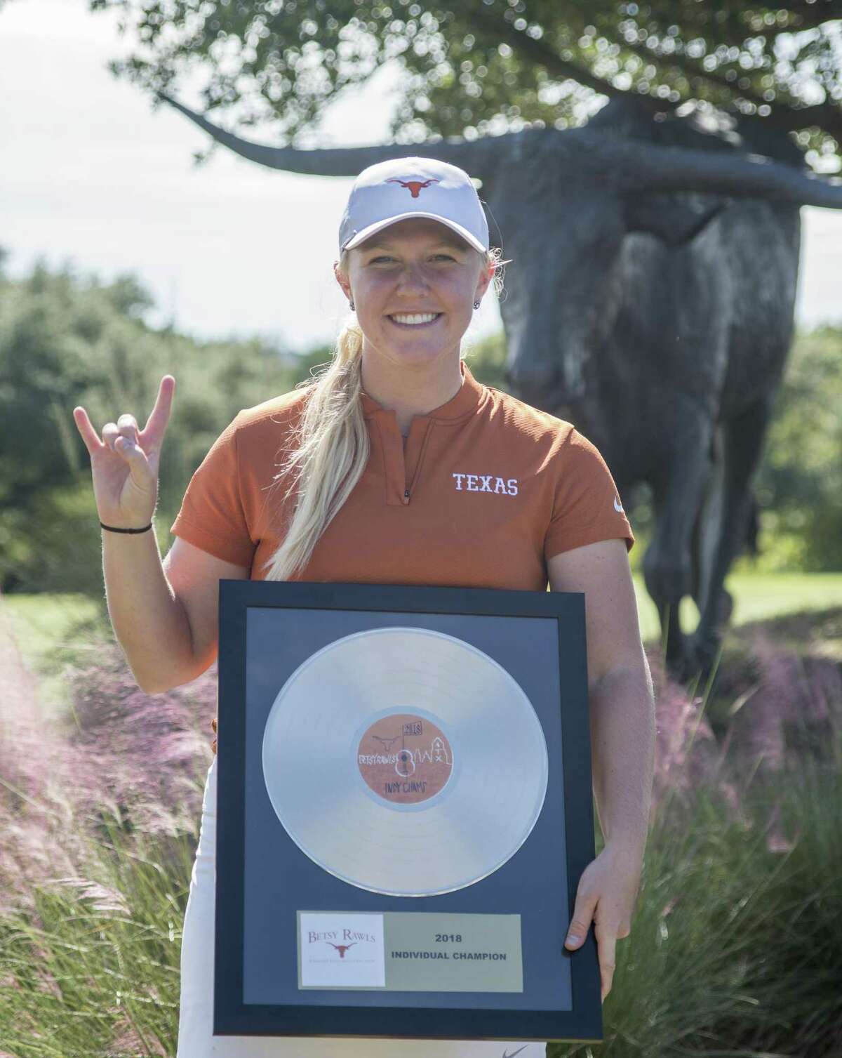 Texas Longhorns freshman Hailee Cooper, a 2018 graduate of Montgomery High School, poses with her first-place award from the Betsy Rawls Invitational this past weekend.