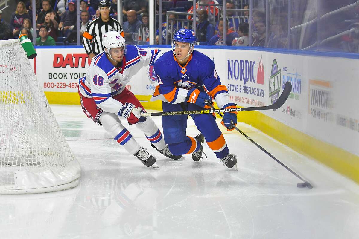 Parker Wotherspoon (41) of the New York Islanders is defended behind the net by Brett Howden (48) of the New York Rangers during a pre-season game played on September 22, 2018 at Webster Bank Arena in Bridgeport, Connecticut.