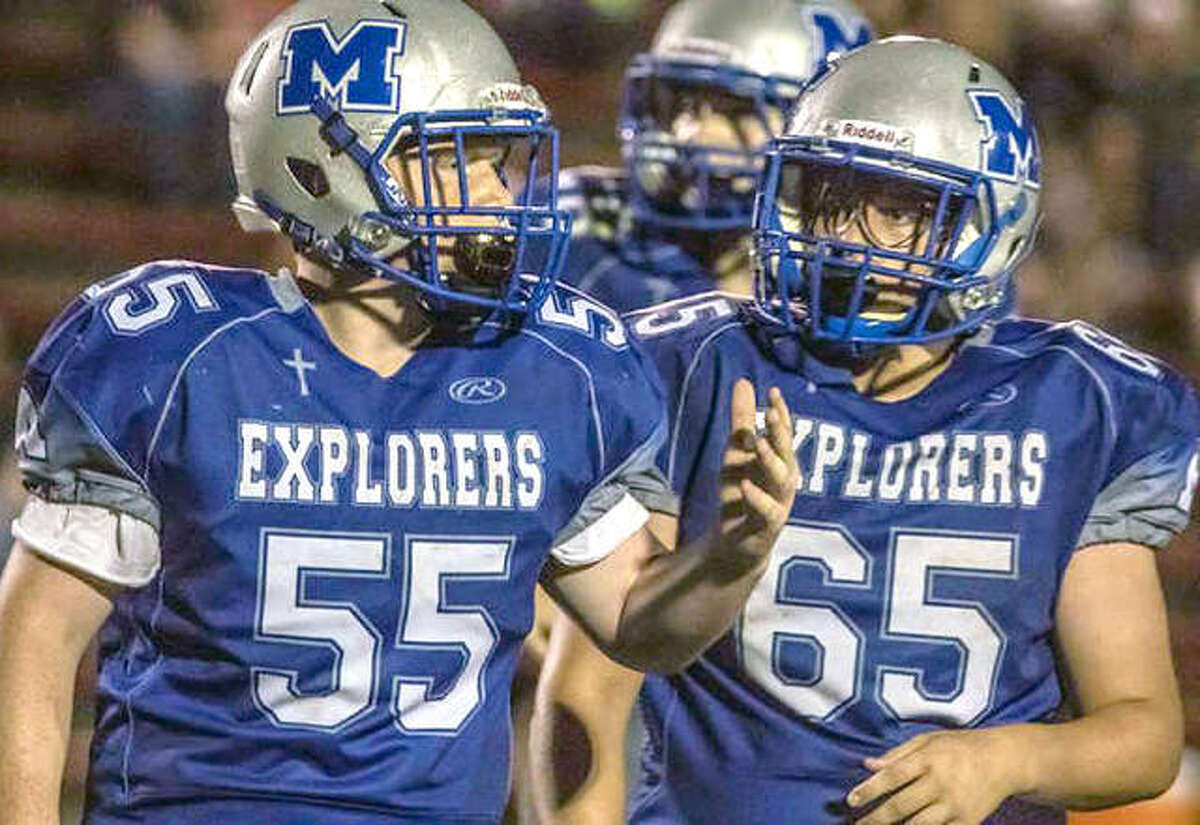 Freshman Colin Roswell (55) and sophomore Owen Thomeczek are among the large group of players who will return next season for Marquette catholic.