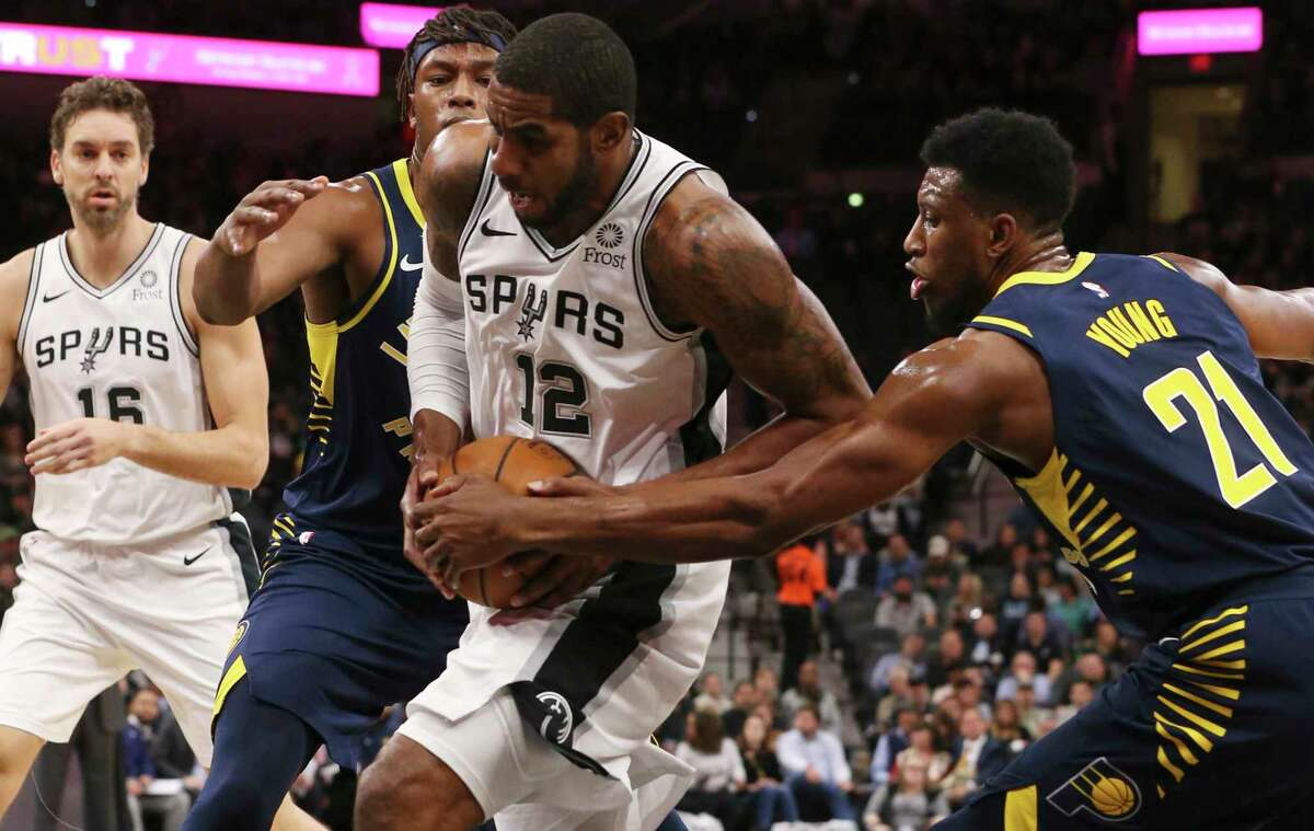 San Antonio Spurs’ LaMarcus Aldridge gets between Indiana Pacers’ Myles Turner and Thaddeus Young during the first half at the AT&T Center, Wednesday, Oct. 24, 2018.