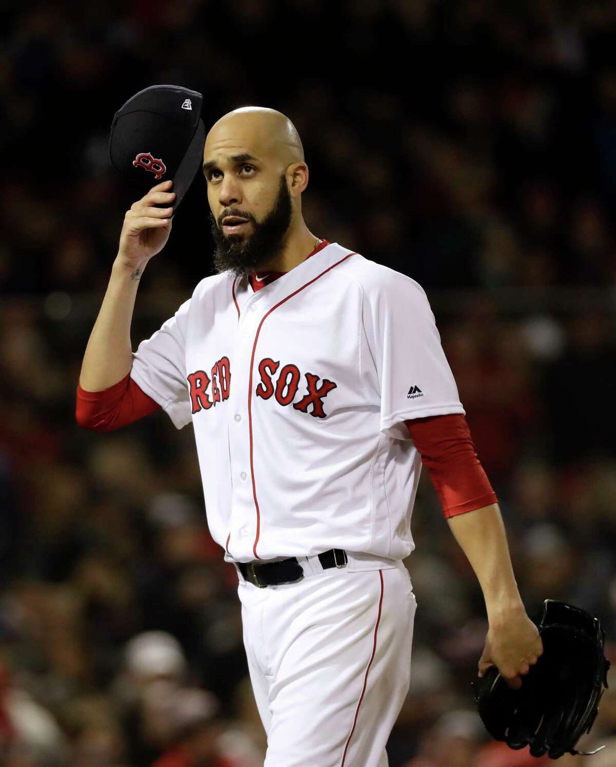 Boston Red Sox's starting pitcher David Price walks off the mound after the first inning of Game 2 of the World Series baseball against the Los Angeles Dodgers game Wednesday, Oct. 24, 2018, in Boston.