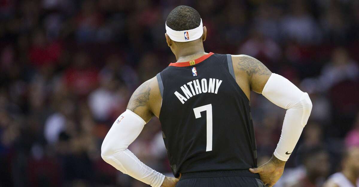 Houston Rockets forward Carmelo Anthony (7) watches during a break in play during the first half of an NBA basketball game between the Houston Rockets and Utah Jazz, Wednesday, Oct. 24, 2018 in Houston.