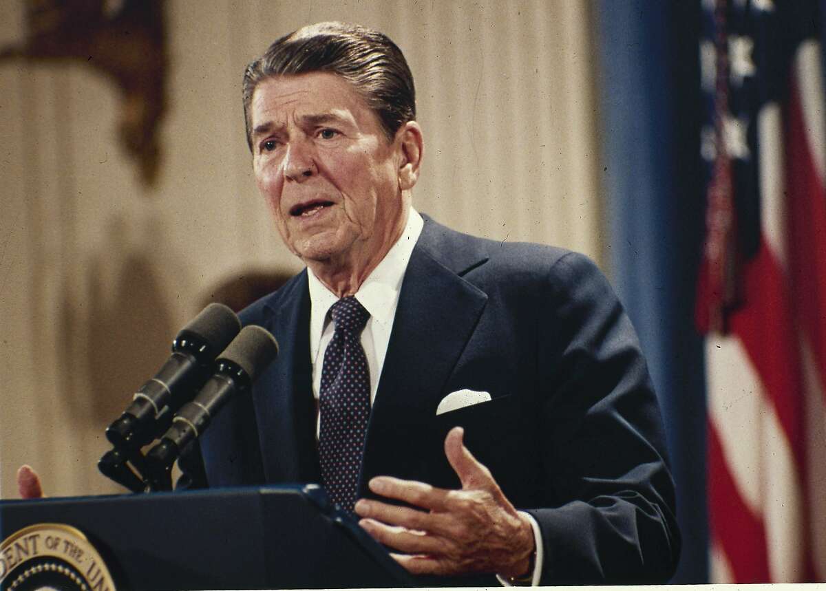 FILE - In this Oct. 19, 1983 file photo, President Ronald Reagan speaks during a news conference at the White House in Washington. President Barack Obama's impending unilateral order awarding legal status to millions of immigrants is not unprecedented. Two of the last three Republican presidents _ Ronald Reagan and George H.W. Bush _ did the same thing in extending amnesty to family members not covered by the last major overhaul of immigration law in 1986. There was no political explosion then comparable to the one Republicans are threatening now. (AP Photo/J. Scott Applewhite, File)