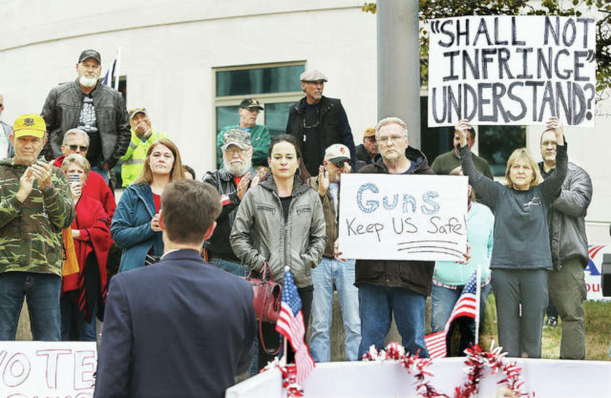 Some of the about 125 people who showed up for a pro-gun rally Thursday at the Madison County Courthouse hold signs and listen to board chairman Kurt Prenzler speak to the crowd about passing a referendum on the November ballot to make Madison County a sanctuary county against further state gun control. It was a rare crowd of mixed Republicans and Democrats all sharing one issue in common, support for their Second Amendment rights. More photos at thetelegraph.com.