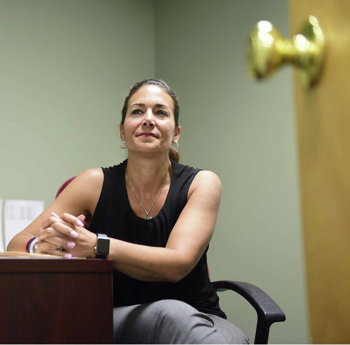 Julie Johnson, a former New Haven police captain, in her BHcare office in East Haven, is the project coordinator of the Family Justice Center, spearheaded by the Umbrella Center for Domestic Violence Services of BHcare.
