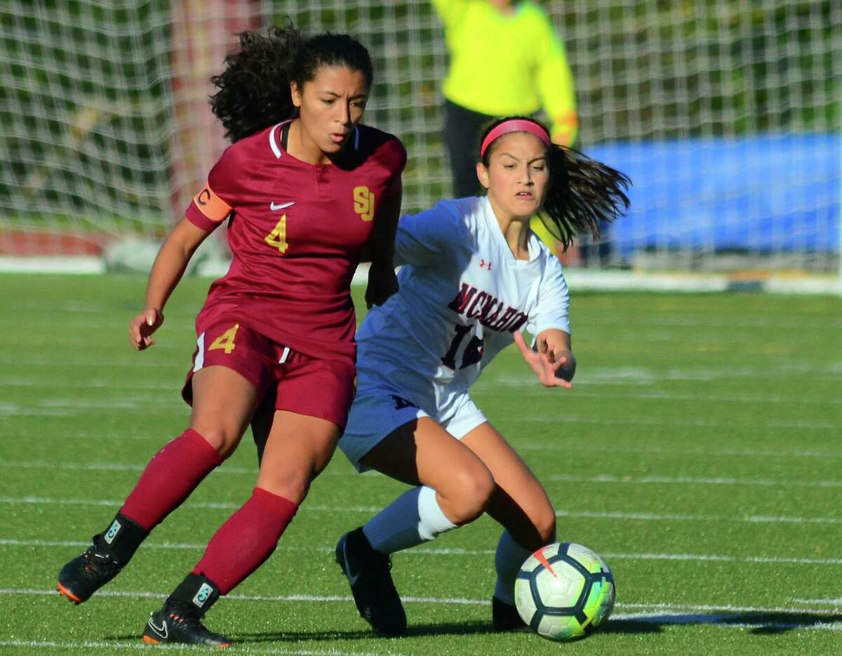 St. Joseph's Jessica Mazo, left, and Brien McMahon's Kailynn Ortiz converge on the ball during girls soccer action in Trumbull, Conn., on Thursday Oct. 25, 2018.